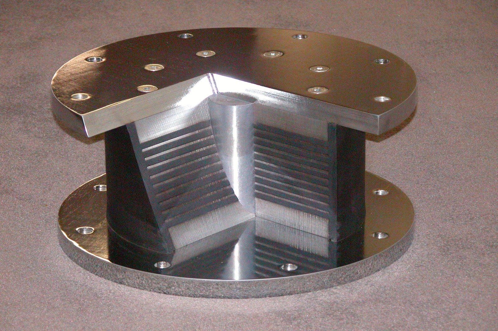 Lead rubber bearing cutaway showing the laminated rubber, steel shims and lead core
